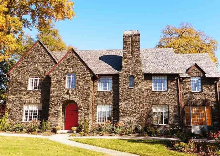 A mansion made of ledge stone.